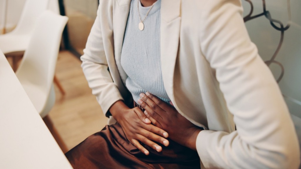 Person holding their abdomen